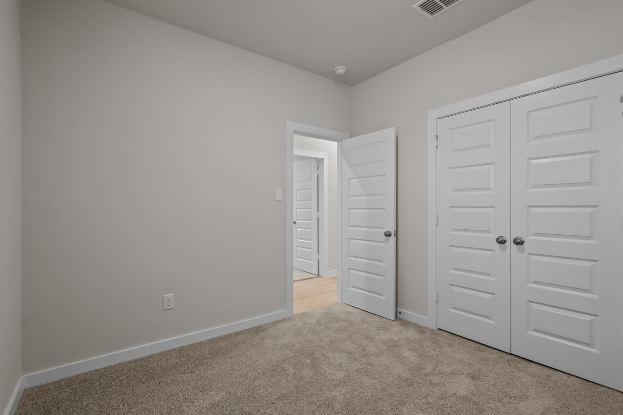 A room with white cabinets.