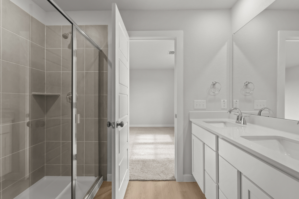 A bathroom with a glass shower.