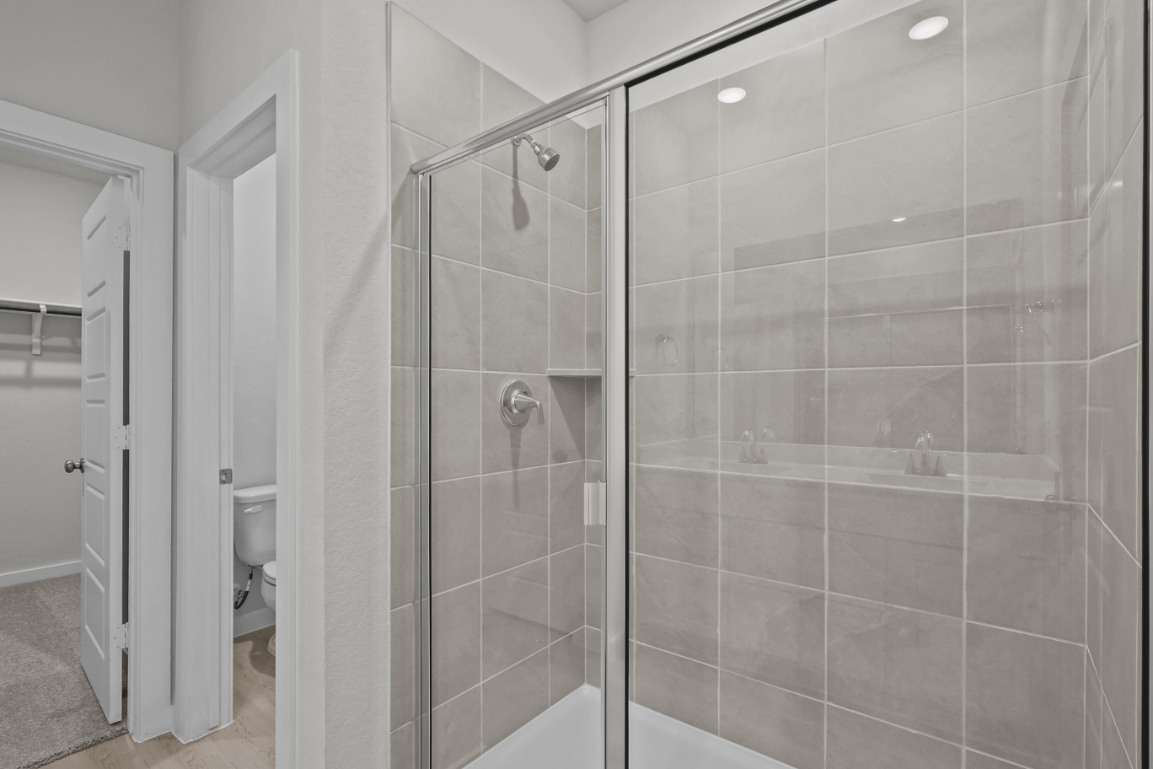 A bathroom with a glass shower.