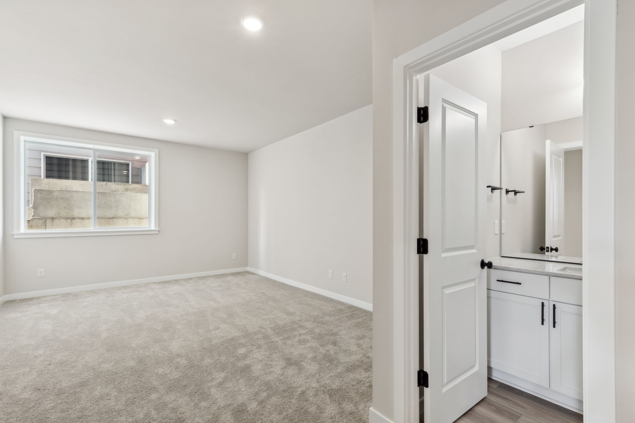 A room with white walls and a white door.