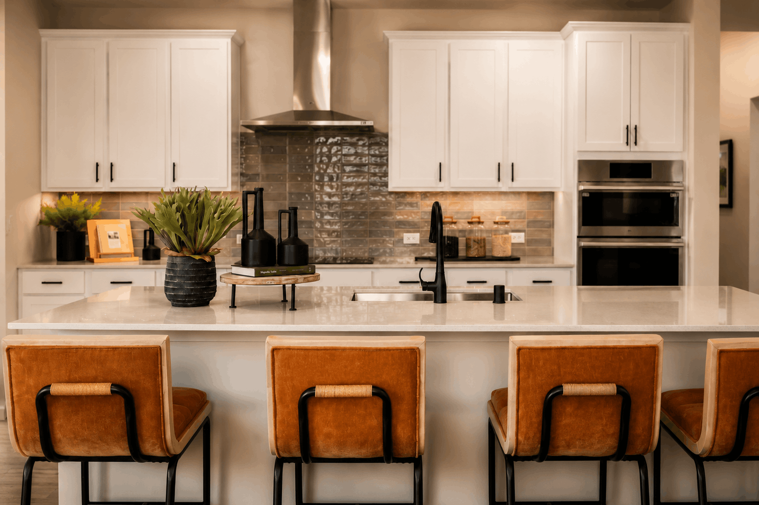 A kitchen with white cabinets.