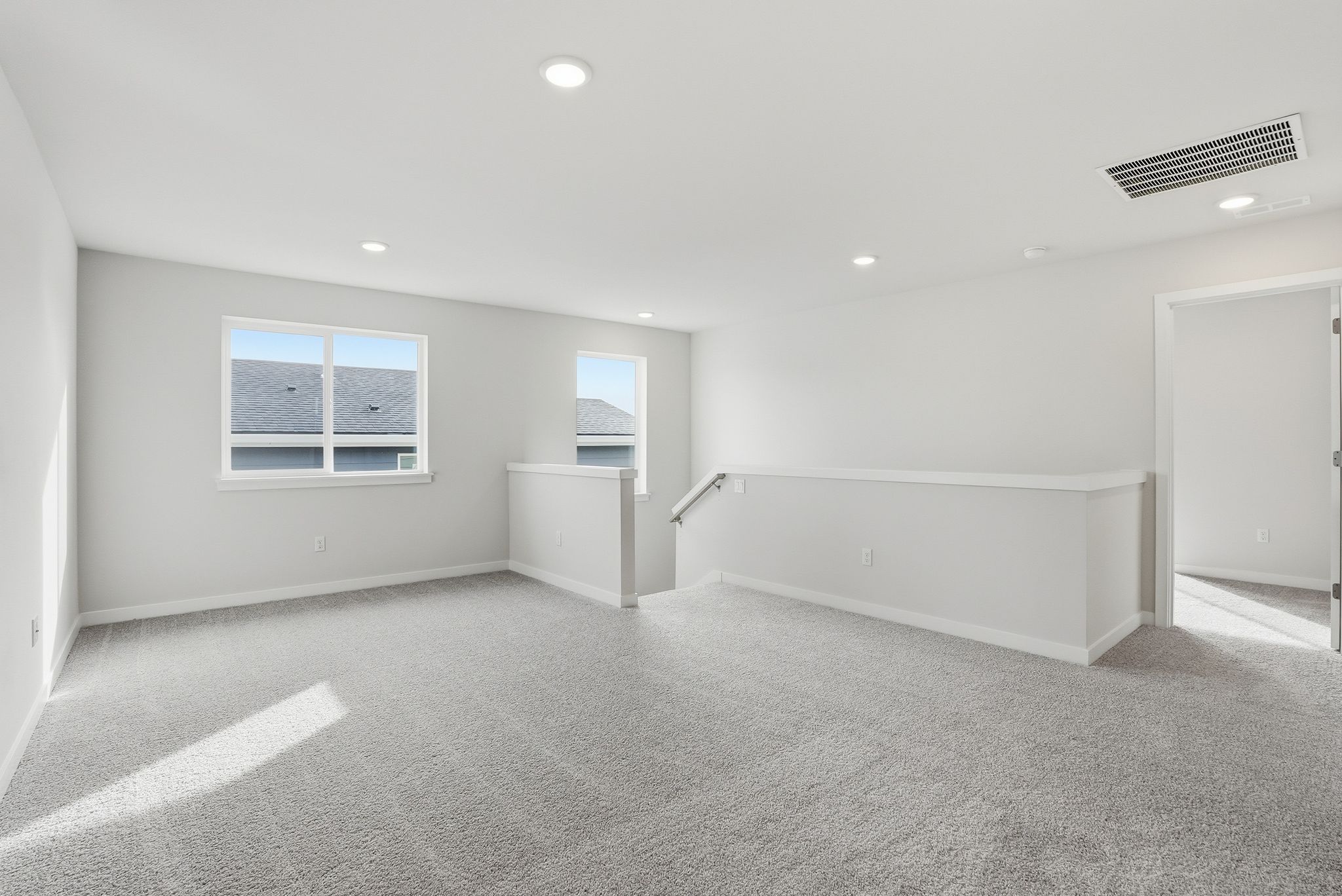 A room with a white wall and a white door.