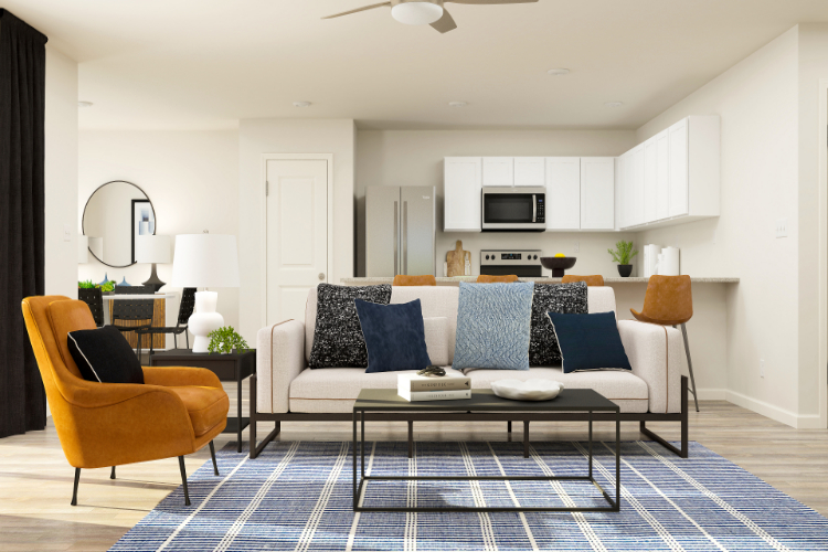 A living room with a couch and a table.