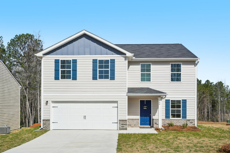 A white house with blue shutters.