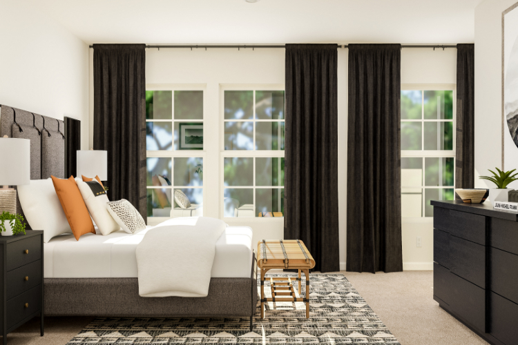 A room with a couch and a table with a window.