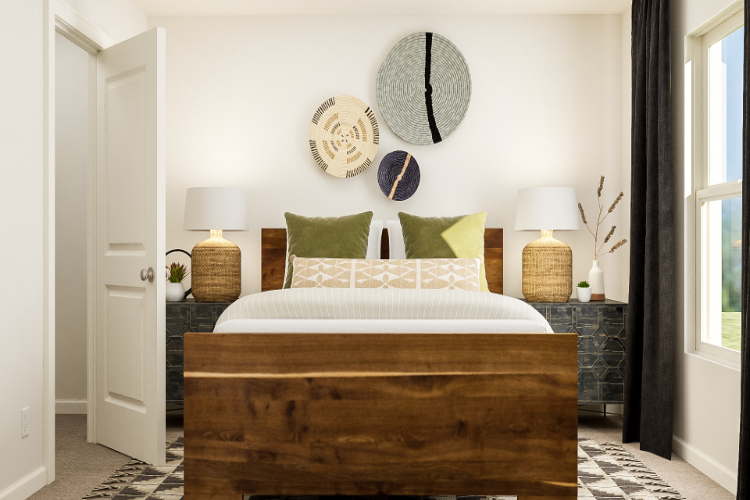 A bed with green pillows.