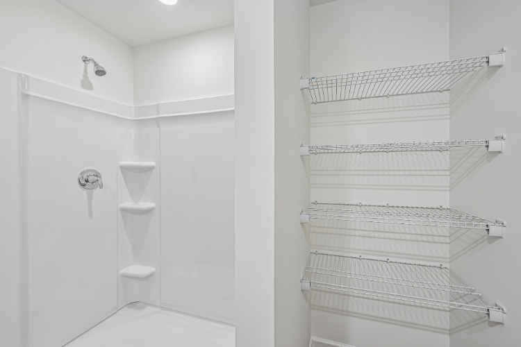 A bathroom with a toilet and sink.