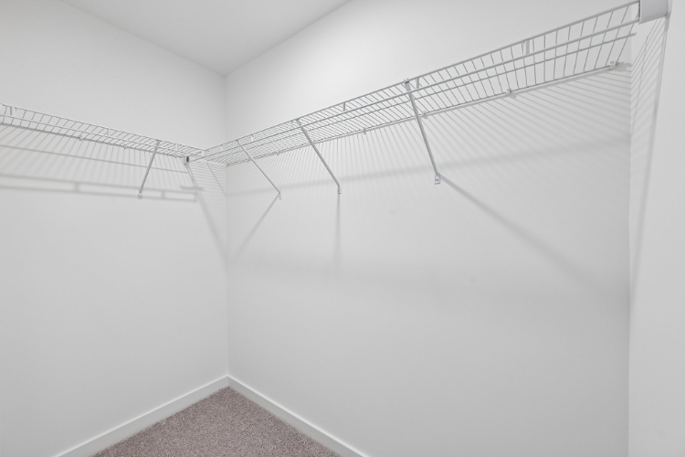 A white wall with a white floor.