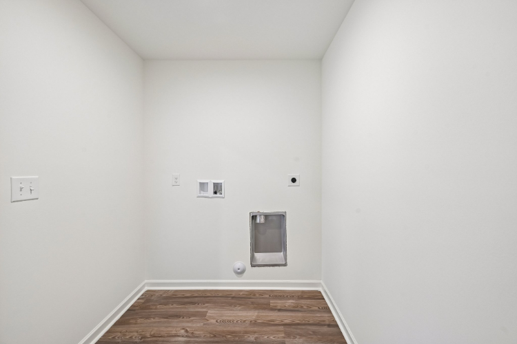 A room with a wood floor and a wood floor.
