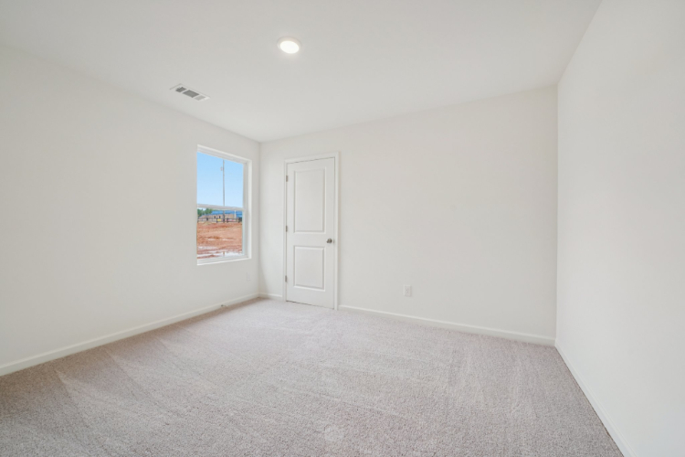 A room with a door and a window.