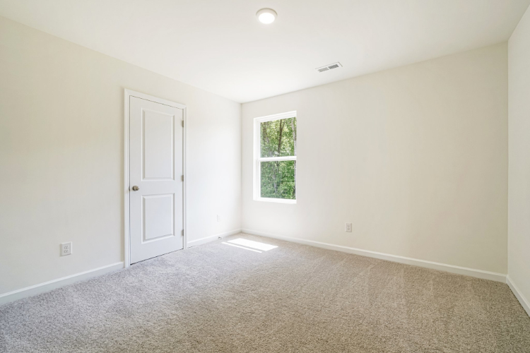 A room with a door and a window.