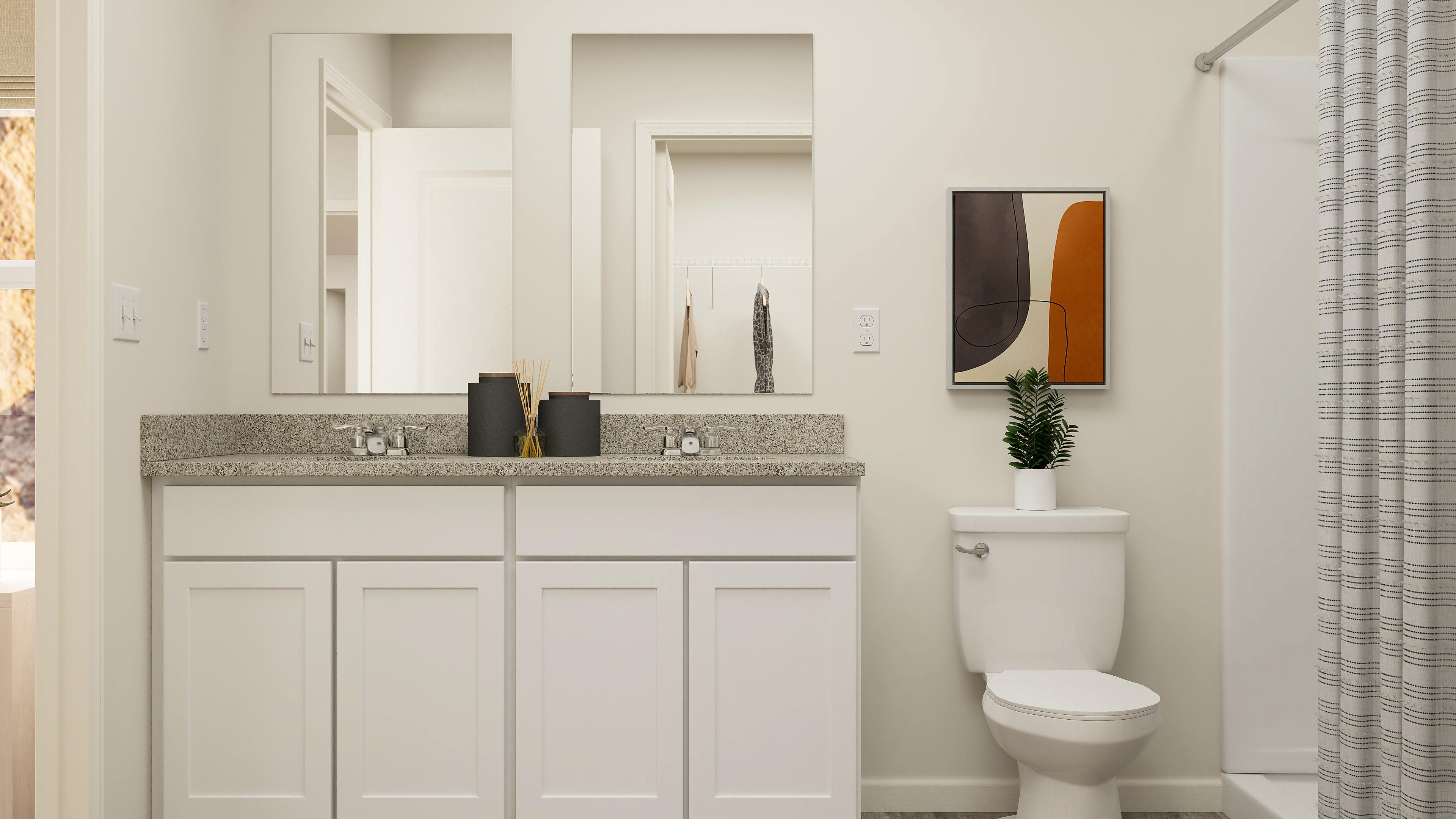 A bathroom with a toilet and sink.
