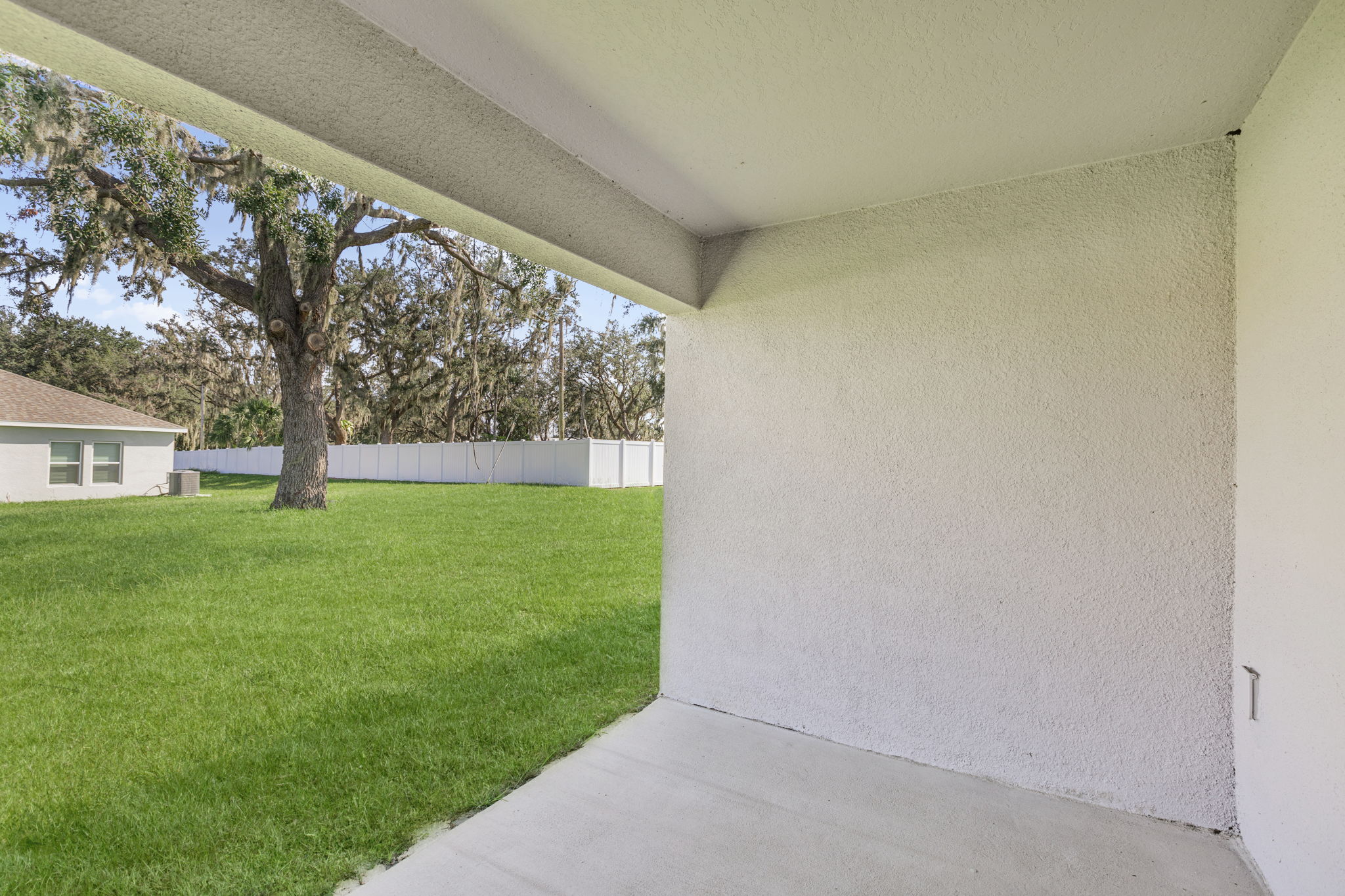 A house with a grass yard.