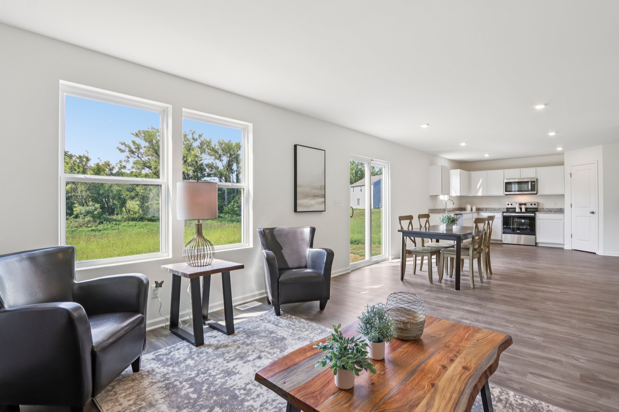 A living room with a wood floor.