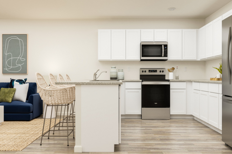 A kitchen with white cabinets.