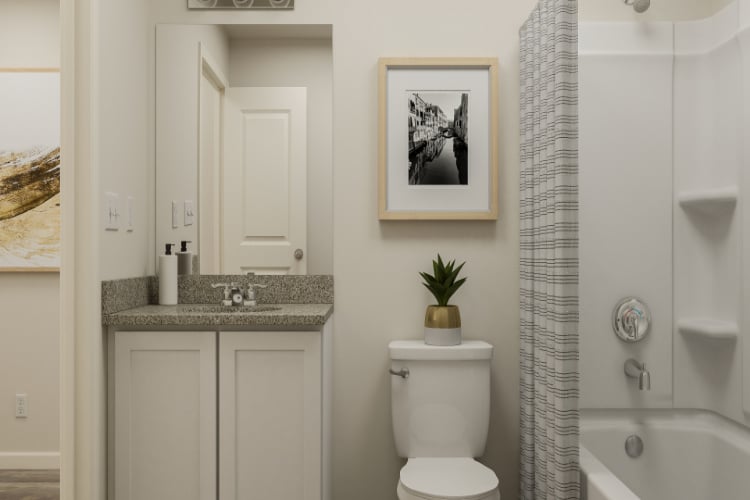 A bathroom with a toilet and sink.